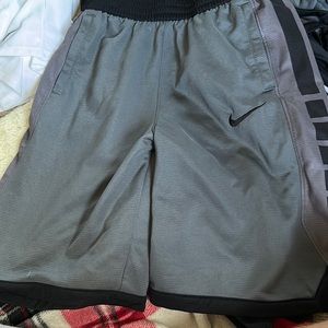 Grey and black Nike shorts, no holes, no stains,